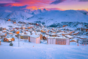 Stunning colourful sunset over Alpe d'Huez ski resort in France
